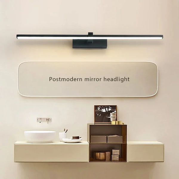 Réglette LED noire au-dessus d'un miroir rond et d'une vasque